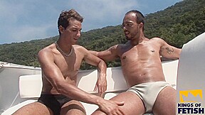 Horny man gets his ass rammed on the boat by a tattooed friend