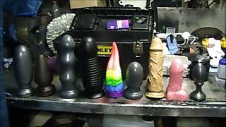 chubby mechanic trying out nine butt plugs