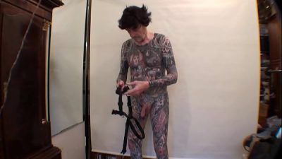 Tattoo Boy LeeHarper Pinnomen Show Off With a Borrowed Fancy Tight Beltstrap used in the Male Stripshow Production – Two Rings are Attached to the Strap – Enabling a Stripper With a P/A to Suspend His Penis Almost Resembling the Look of Aboriginals in PNG