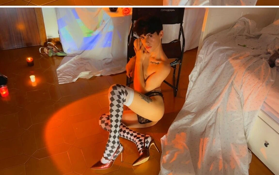 Theatrical Femboy in Heels & Harlequin Stockings – Candles & Sensual Vibes